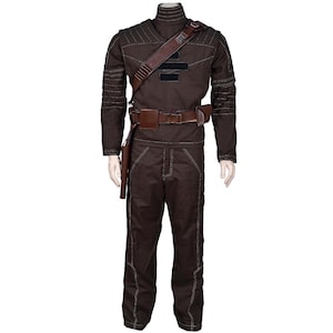 May include: A brown costume with a high collar, long sleeves, and matching pants. The outfit includes a brown leather belt, shoulder strap, and holster. White stitching accents the seams of the costume. The costume is displayed on a mannequin.