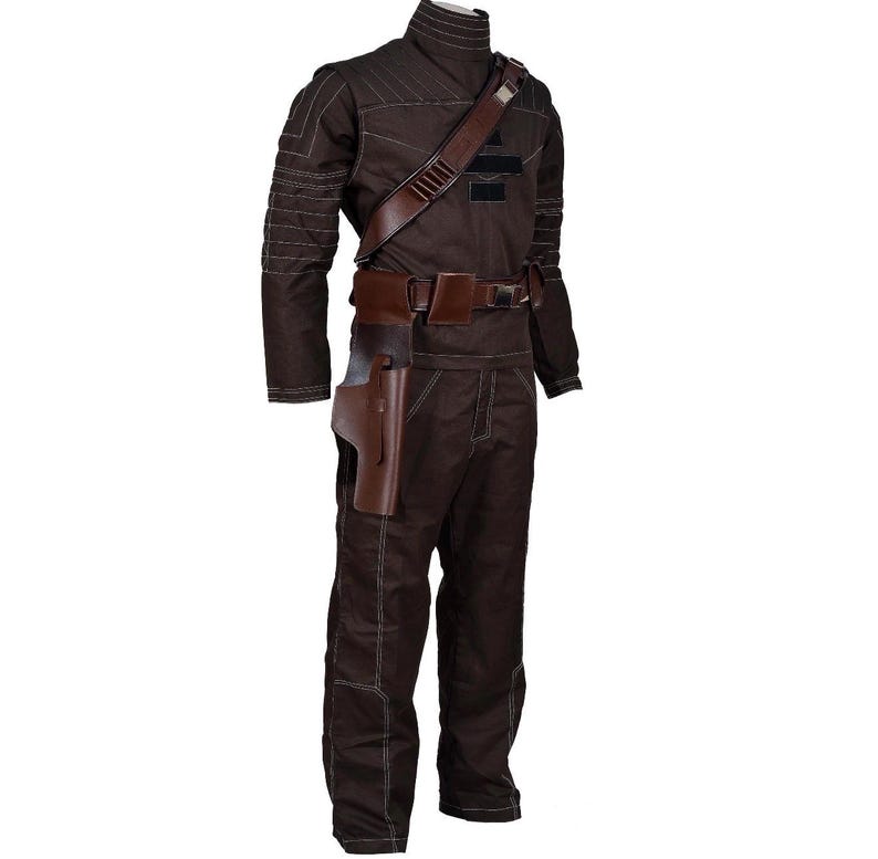 May include: A brown jumpsuit with a high collar, shoulder strap, and belt. The costume includes a holster and is made of a durable fabric. White stitching accents the seams. This outfit is suitable for cosplay or costume events.