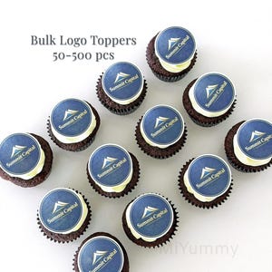 May include: A dozen chocolate cupcakes with white frosting, each topped with a blue and white logo. The logo reads "Summit Capital". Text in the image reads "Bulk Logo Toppers 50-500 pcs".
