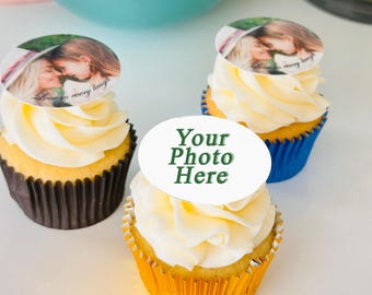 May include: Three cupcakes with white frosting and edible photo toppers. The toppers feature a photo of two people and the text "Love in every laugh." One cupcake has a "Your Photo Here" topper. Cupcakes are in brown, blue, and gold wrappers.