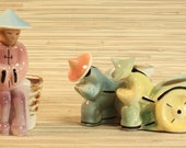Trio of Asian quot oriental quot rickshaw and basket planter figurines 1950s California pottery