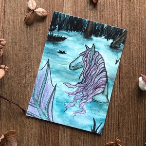 May include: Watercolor painting of a mermaid with long purple hair and a blue tail. The mermaid is in a dark blue water with a forest in the background.