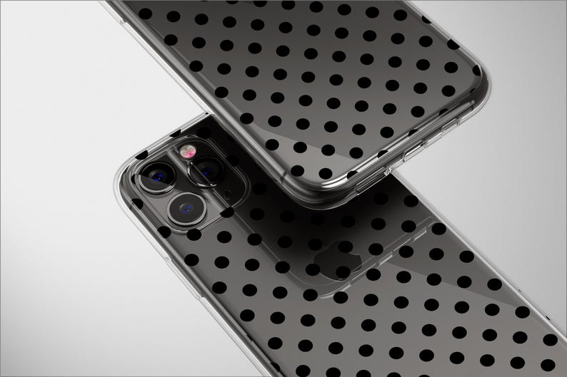 May include: Two clear phone cases with a black polka dot pattern. The cases are transparent, allowing the phone's design to show through. The cases are made of a durable material and offer protection for the phone.