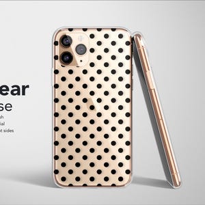 May include: Clear phone case with a black polka dot pattern on a gold background. The case is leaning against a matching phone. The text "Clear Case" is visible, along with "Matte Finish, Soft Material, Transparent sides."