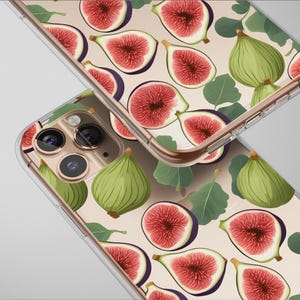 May include: Two clear phone cases with a fig fruit pattern. The design features green figs, sliced figs with red flesh, and green leaves on a light beige background. The cases have a gold-colored frame.