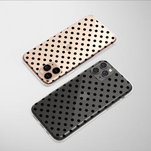 May include: Two smartphone cases with a polka dot pattern. One case is gold with black dots, and the other is black with black dots. The cases have a clear, protective design and are shown on a white background.