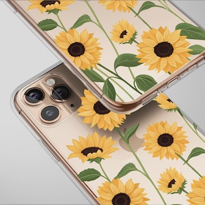 May include: Clear phone cases with a sunflower design. The cases feature yellow sunflowers with dark brown centers and green leaves. The design is printed on a clear case, allowing the phone's color to show through.