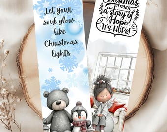 Puede incluir: Dos marcapáginas con temática navideña. Uno presenta un oso de peluche y un pingüino con el texto "Let your soul glow like Christmas lights." El otro tiene una niña con alas de ángel y el texto "Christmas is not a story of Hope, it's Hope!"