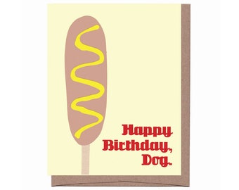 May include: A yellow and brown birthday card with a cartoon hot dog with mustard on it. The card says "Happy Birthday, Dog."
