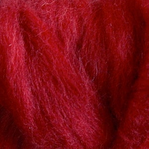 May include: A close-up of a deep red wool roving. The fibers are soft and fluffy, perfect for felting or spinning.