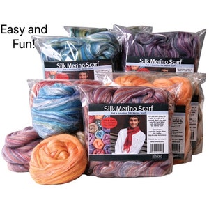 May include: Five packages of colorful silk merino wool for felting a scarf. Each package contains a different color combination of wool and includes instructions for felting a scarf. The text on the package reads "Silk Merino Scarf Felt a luxurious Silk Merino Scarf".