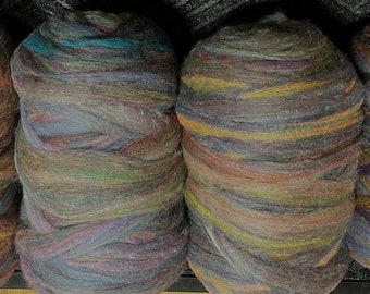 May include: Four balls of colorful wool yarn, each with a different blend of colors, including shades of brown, blue, green, and yellow.