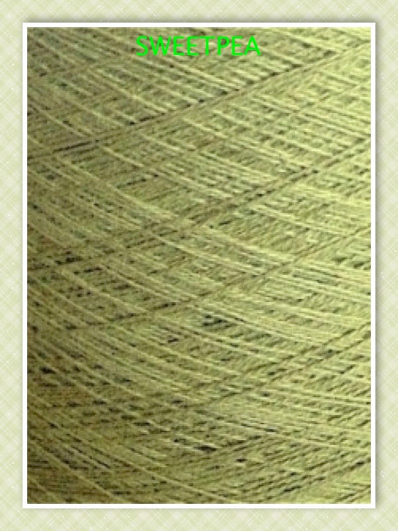 May include: A close-up of a skein of light green yarn. The yarn is made of natural fibers and has a soft, textured appearance.