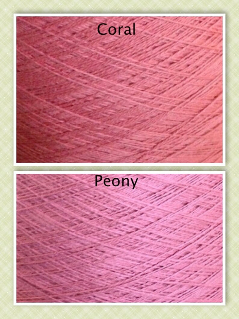 May include: Close-up of two skeins of yarn, one in a coral color and the other in a peony color. The yarn is soft and textured.