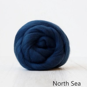 May include: A ball of deep blue wool roving, labeled "North Sea".