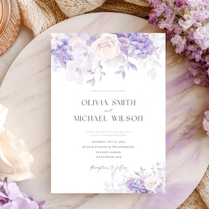 May include: A rectangular wedding invitation card featuring a floral border of purple hydrangeas and white roses. The text reads: Olivia Smith and Michael Wilson, Saturday, Oct 15, 2024, at four o'clock in the afternoon, The Rose Garden, 123 Blossom Lane.