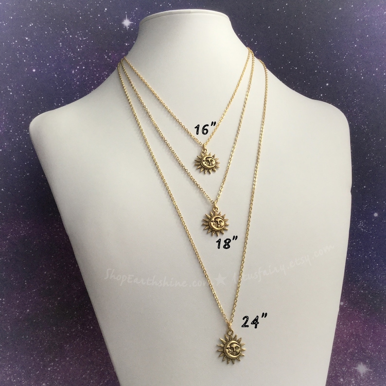 May include: Three gold necklaces with a sun pendant on each. The necklaces are 16 inches, 18 inches, and 24 inches long.