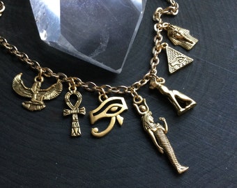 Gold Egyptian necklace, Eye of Ra, Winged Goddess, Pyramid, Bastet, 24k plated charm necklace