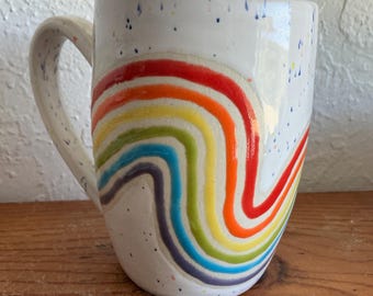 Wheel thrown and hand painted ceramic pottery stoneware mug for tea or coffee. Rainbow stripes and colorful speckled glaze. Holds 16 oz