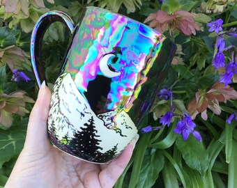 Wheel thrown and hand painted ceramic pottery stoneware mug or cup for tea or coffee. Black white tree mountains moon, iridescent glaze
