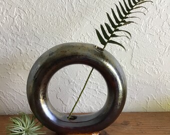 Wheel thrown and hand painted ceramic pottery stoneware round circle donut vase with iridescent metallic dark star crystal glaze