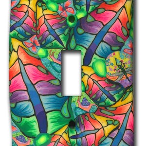 May include: A colorful light switch cover with a psychedelic pattern of butterflies, dragonflies, and snails. The background is a vibrant green with shades of blue, purple, pink, and yellow.