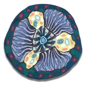 May include: A round, teal-colored ceramic tile with a colorful, abstract design. The design features a central, star-shaped motif with three curved, yellow, white, and pink arms extending outward. The tile is surrounded by a border of teal and red squares.