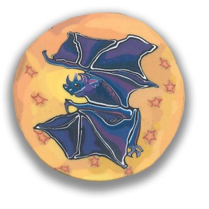 May include: A purple bat with its wings spread wide flies in front of a yellow moon with red stars.