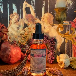 May include: A small amber glass bottle with a dropper top and a label that reads "Renew in your youthful glow with nourishing botanical oils.  Crafted to preserve, refresh & revitalize."  The label also lists the organic ingredients:  Rosehip, Rosa Canina, Evening Primrose, Dorotheira Rennii, Pomegranate Seed, Punica Granatum, Argan Oil, Argania Spinosa, Monophat Shamncode 22, Dog Ear Cactus Oil, Essential Oil, Rosemary, Frankincense, Witch Hazel, Aloe Vera,  and  Towellia Serrata.