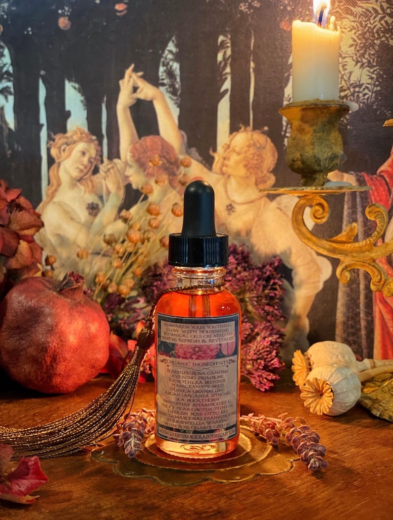 May include: A small amber glass bottle with a dropper top and a label that reads "Renew in your youthful glow with nourishing botanical oils.  Crafted to preserve, refresh & revitalize."  The label also lists the organic ingredients:  Rosehip, Rosa Canina, Evening Primrose, Dorotheira Rennii, Pomegranate Seed, Punica Granatum, Argan Oil, Argania Spinosa, Monophat Shamncode 22, Dog Ear Cactus Oil, Essential Oil, Rosemary, Frankincense, Witch Hazel, Aloe Vera,  and  Towellia Serrata.