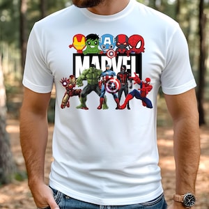 May include: White t-shirt with a graphic print of Marvel superheroes, including Iron Man, Hulk, Captain America, Thor, and Spider-Man. The text "MARVEL" is printed in black below the superheroes.