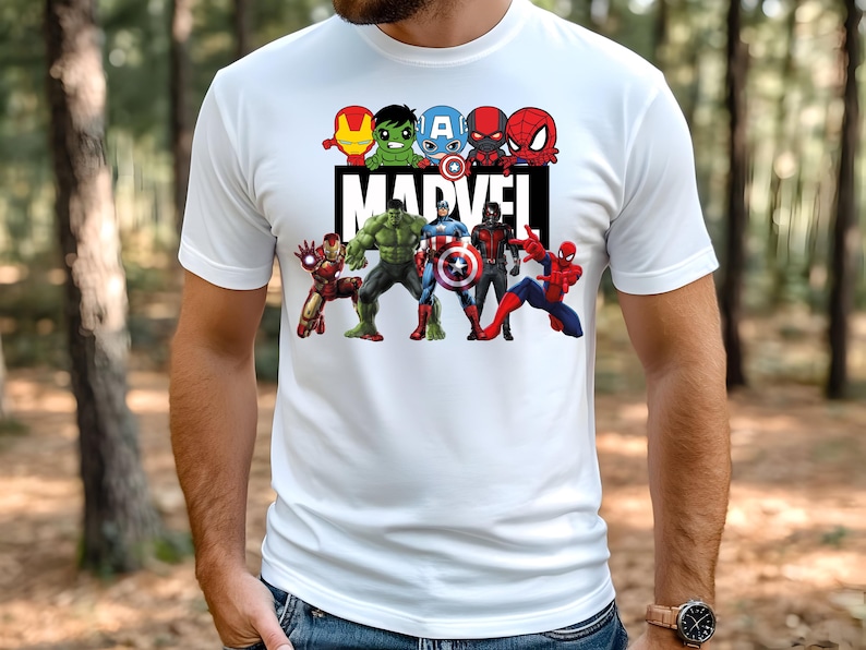 May include: White t-shirt with a graphic print of Marvel superheroes, including Iron Man, Hulk, Captain America, Thor, and Spider-Man. The text "MARVEL" is printed in black below the superheroes.