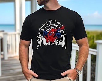 May include: Black t-shirt with a white spider web design and a red and blue Spiderman graphic. The text "SPIDER-MAN" is printed in white below the graphic.