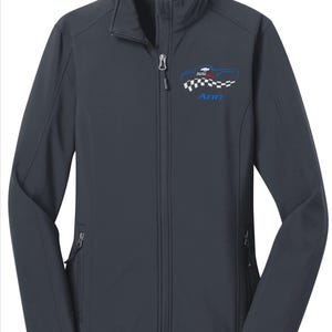 May include: A navy blue zip-up jacket with a stand-up collar. The jacket features a car graphic with the text "SS" and "Ann" in blue. The graphic includes a checkered flag design. The jacket has two zippered pockets.