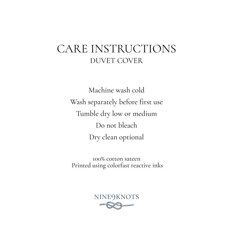 May include: White background with text: CARE INSTRUCTIONS, DUVET COVER. Instructions include: machine wash cold, wash separately, tumble dry low or medium, do not bleach, dry clean optional. Made of 100% cotton sateen. Printed using colorfast reactive inks. Nine9knots logo.