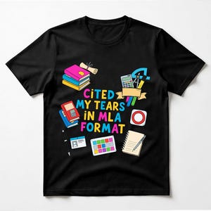 May include: Black t-shirt with a colorful graphic design featuring books, a calculator, and the text "CITED MY TEARS IN MLA FORMAT." Additional illustrations include a notepad, ID card, and color palette.