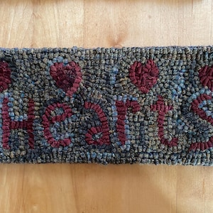 Handmade primitive style hooked word sign rug Hearts