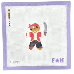 May include: A square needlepoint canvas featuring a gingerbread pirate character with a red bandana, eye patch, and sword. The design includes a color palette guide on the left, the text FNM44 in the bottom left, and the text F star N in the bottom right.