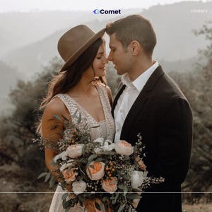 May include: A couple in an outdoor embrace, the woman in a hat and detailed dress, holding a floral bouquet. The man wears a black suit. The background shows a blurred landscape and the text "JOHN & LIZA" and "Wedding Stories".