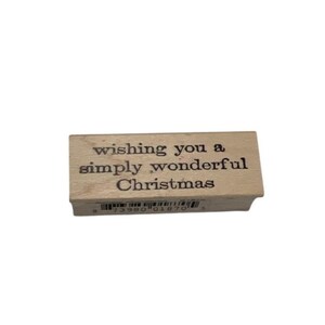 Tarjeta con sello de goma y álbum de recortes de Memory Box "Deseándote una maravillosa Navidad"