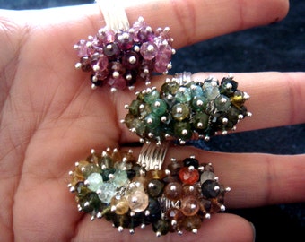 pink gemstone cluster ring, green gemstone, blue gemstone too, CATERPILLAR, tourmaline cluster ring with rainbow colour tourmalines