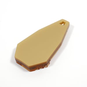 May include: A layered, geometric, brown and gold pendant with a hole at the top for hanging.