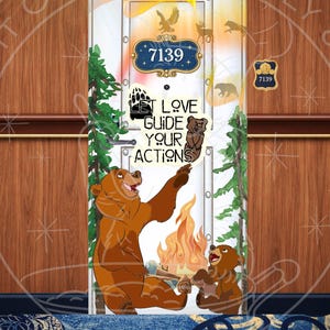 May include: A decorative door featuring a cartoon bear family gathered around a campfire. The door has a blue and gold sign with the number 7139. Text on the door reads "LET LOVE GUIDE YOUR ACTIONS". The door is decorated with bear and forest animal silhouettes.