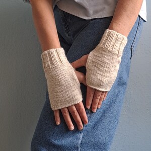 These cream fingerless gloves are hand knitted with special love and care. They are perfect for keeping you warm in cold autumn/winter days!