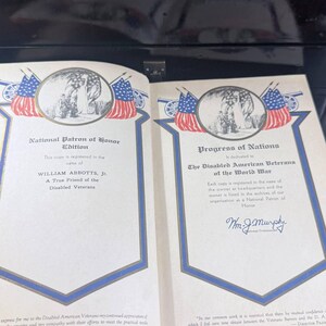 May include: An open book with two pages displayed, each with patriotic imagery and text. The left page is titled "National Patron of Honor Edition", the right "Progress of Nations". Both pages have a blue border and contain text.