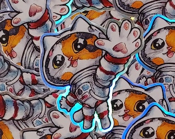 Puede incluir: Colección de pegatinas holográficas con un gato de dibujos animados con traje de astronauta. El gato tiene pelaje naranja, blanco y negro, con ojos grandes y una expresión sonriente. El traje de astronauta es blanco con detalles rojos y plateados.
