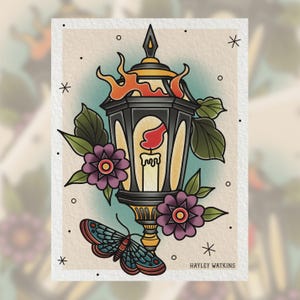 May include: A traditional tattoo style illustration of a black lantern with a lit candle inside. The lantern is surrounded by green leaves, purple flowers, and a blue butterfly. The text "HAYLEY WATKINS" is at the bottom of the image.