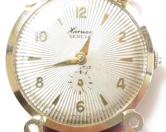 Orologio retrò anni '40 Harman 17 rubini in oro giallo 14 carati Geneva Fancy Angs Cassa n. 69689 Fine