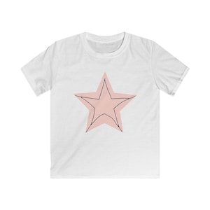 May include: White t-shirt with a pink star outlined in black.