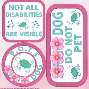 May include: Embroidered patches in pink and white, featuring teal text and turtle designs. One patch states "NOT ALL DISABILITIES ARE VISIBLE." Another says "DO NOT PET DOG." A third patch has "P.O.T.S. DOG" and a turtle.